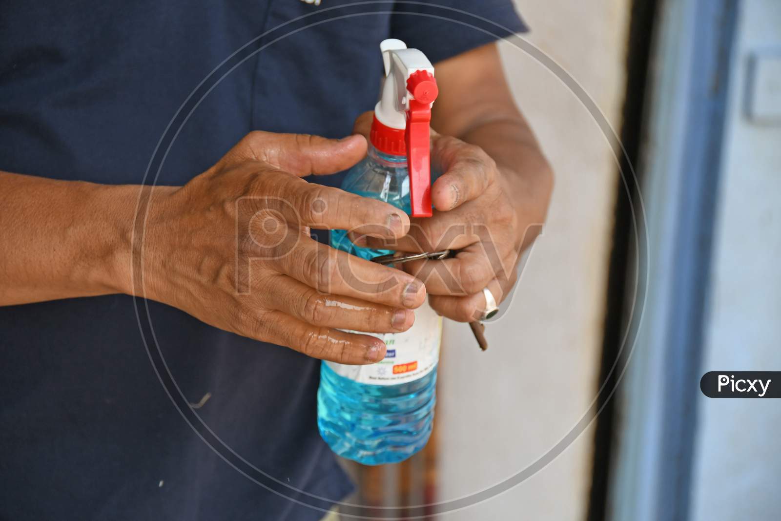 People are using alcohol based hand sanitizers to prevent Novel Coronavirus (COVID-19) infections. At Burdwan Town, Purba Bardhaman District, West Bengal, India.