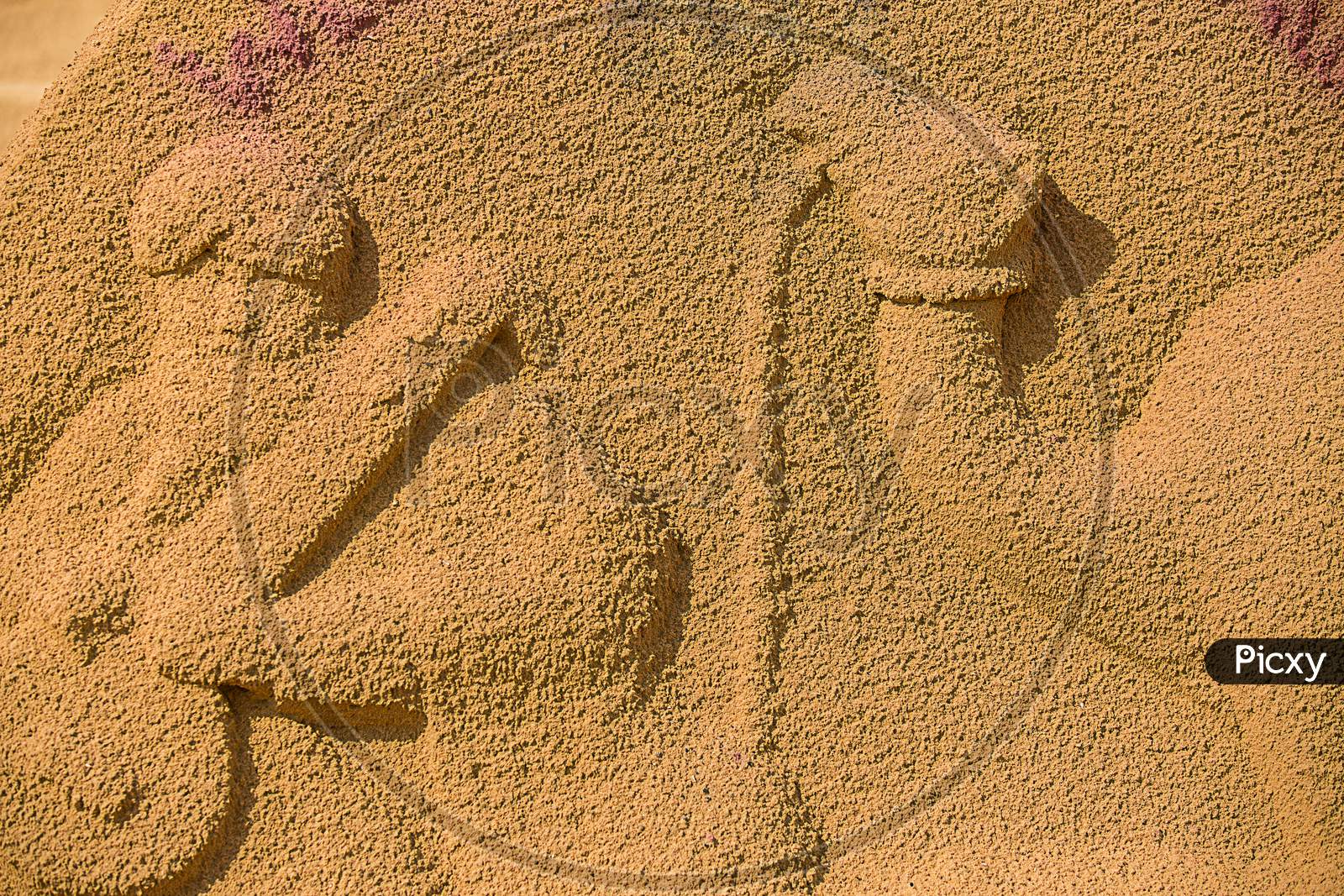 Sand Sculpture Art Of A Man And A Camel At Pushkar Camel Fair.