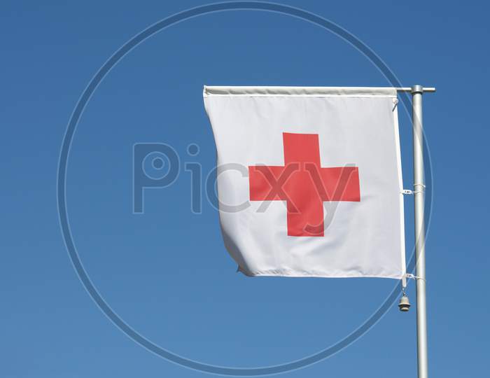 International Red Cross Flag Against Blue Sky