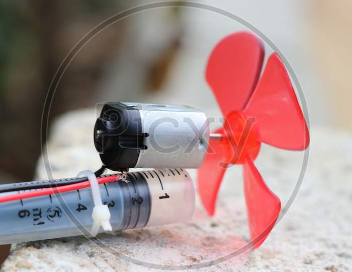 Toy Dc Motor With Plastic Fan On Its Shaft For Air Blowing