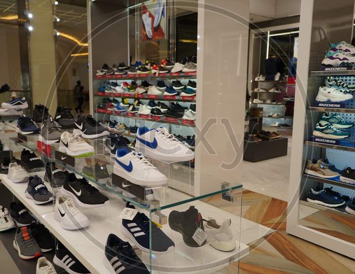 Dubai Uae December 2019 Nike Brand Sport Shoes At A Shop. Footwear Of Various Brands In The Mall. Big Collection Of Different Sport Shoes.
