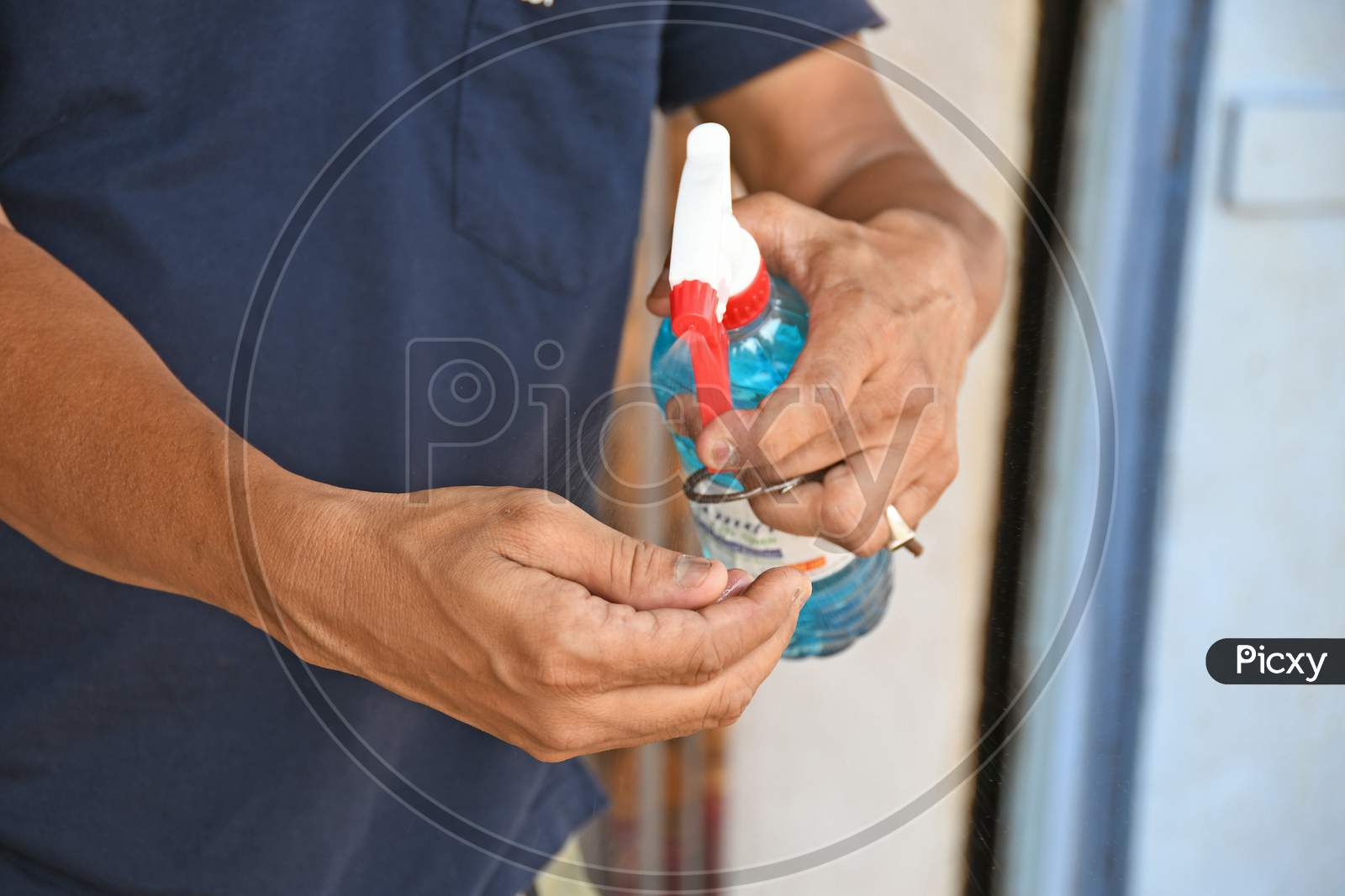 People are using alcohol based hand sanitizers to prevent Novel Coronavirus (COVID-19) infections. At Burdwan Town, Purba Bardhaman District, West Bengal, India.