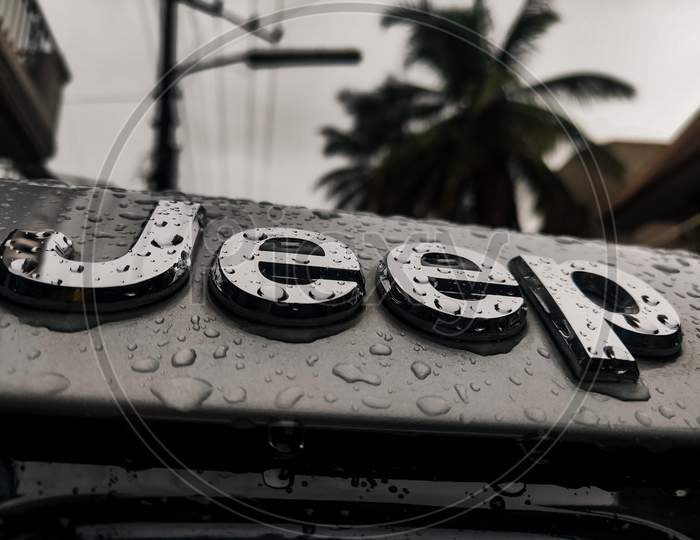 Jeep logo during rain