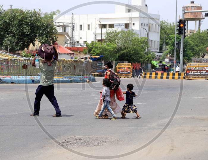 Migrant Workers' Family Walking On roads Carrying Luggage To Their Native Places During Extended Nationwide Lockdown Amidst Coronavirus Or COVID-19 Pandemic in Prayagraj