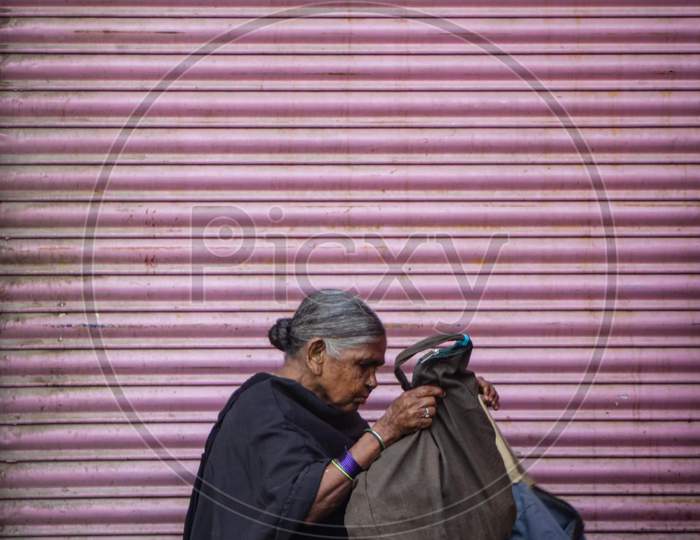 Old woman in Charminar streets