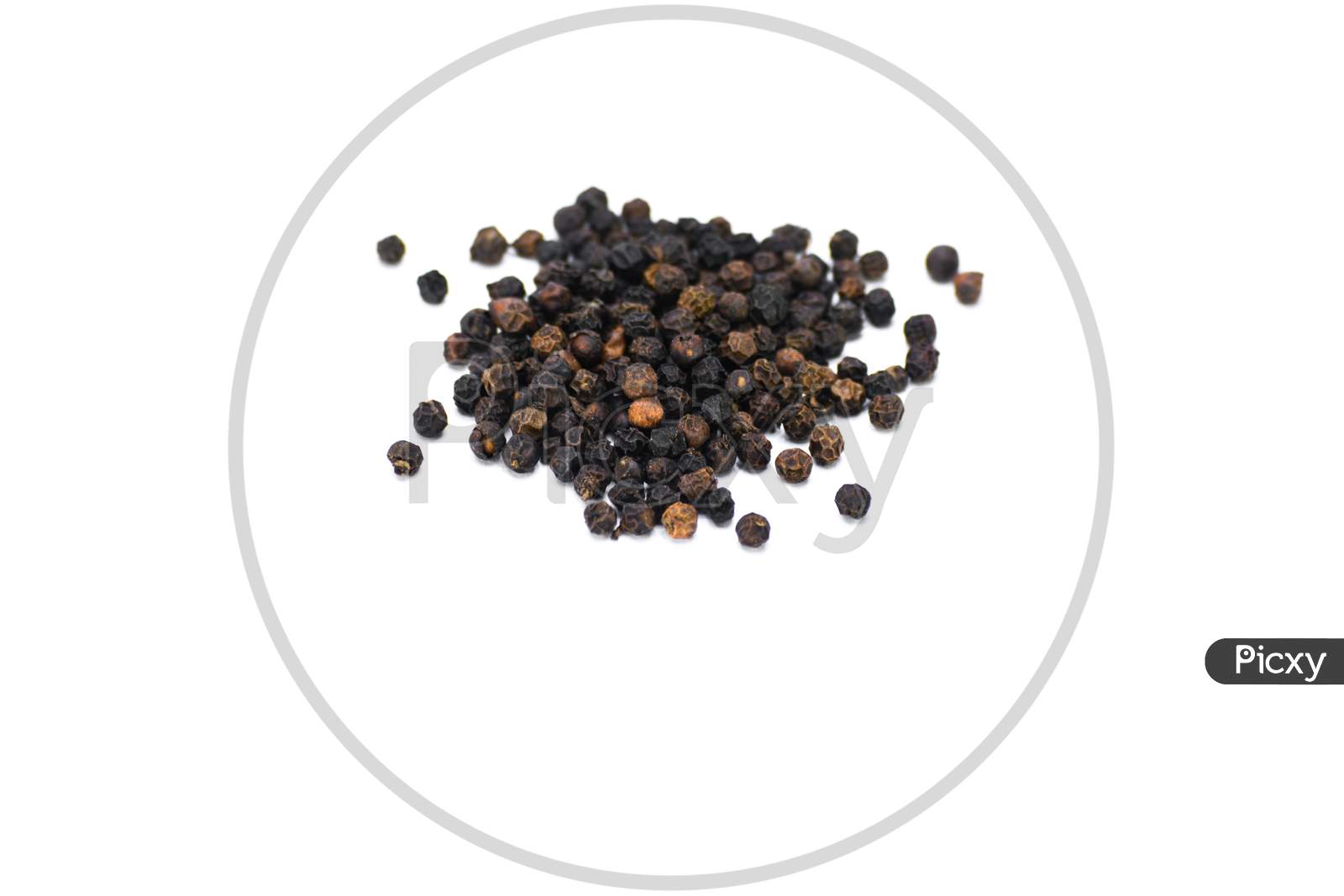 Black peppercorns isolated on white background