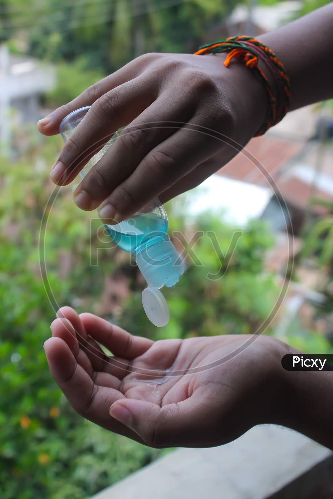 Using Hand Sanitizer  for kill germs & fighting Against corona virus
