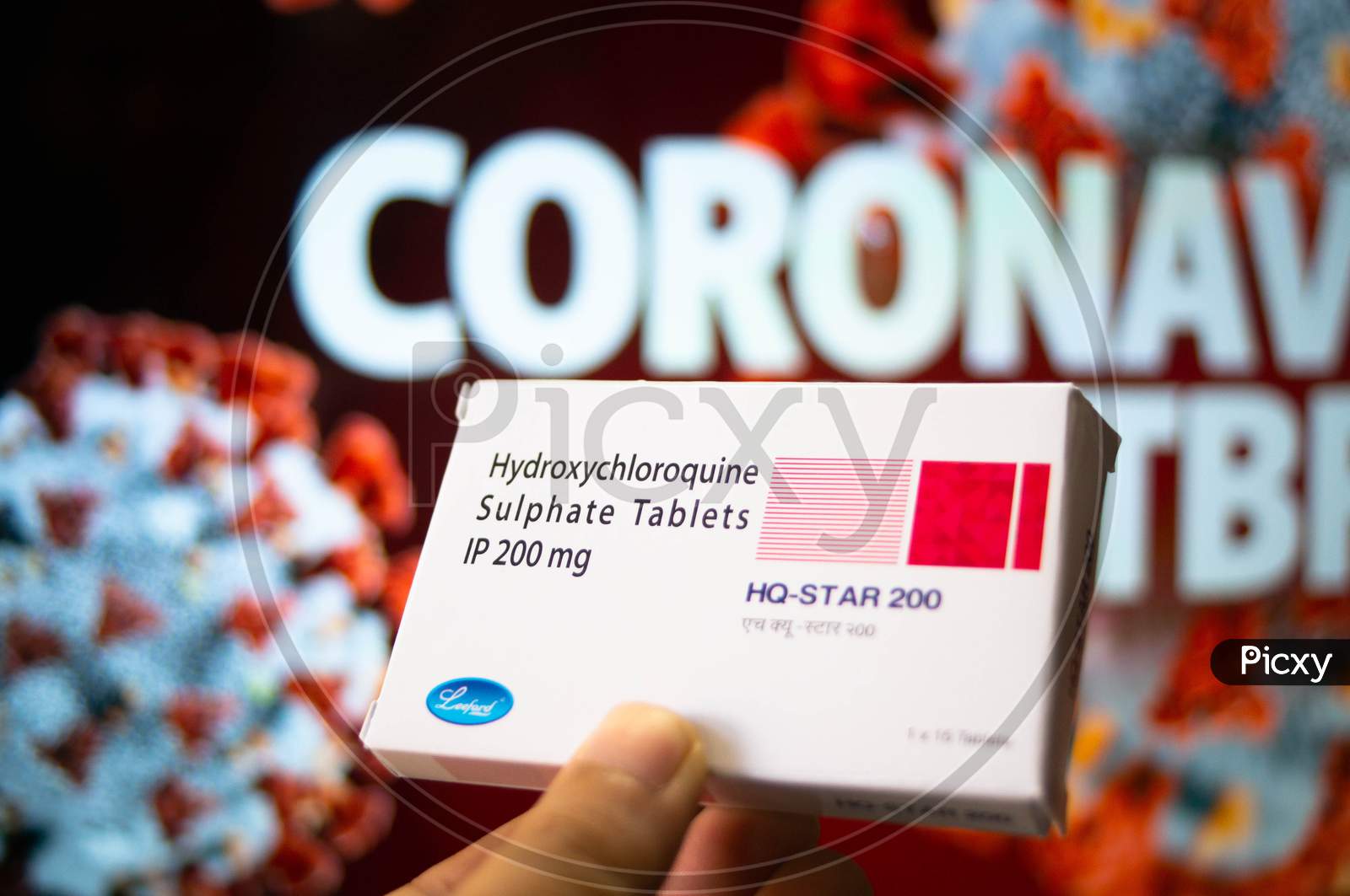 Hydroxychloroquine Sulphate Tablets With Coronavirus Written In Background