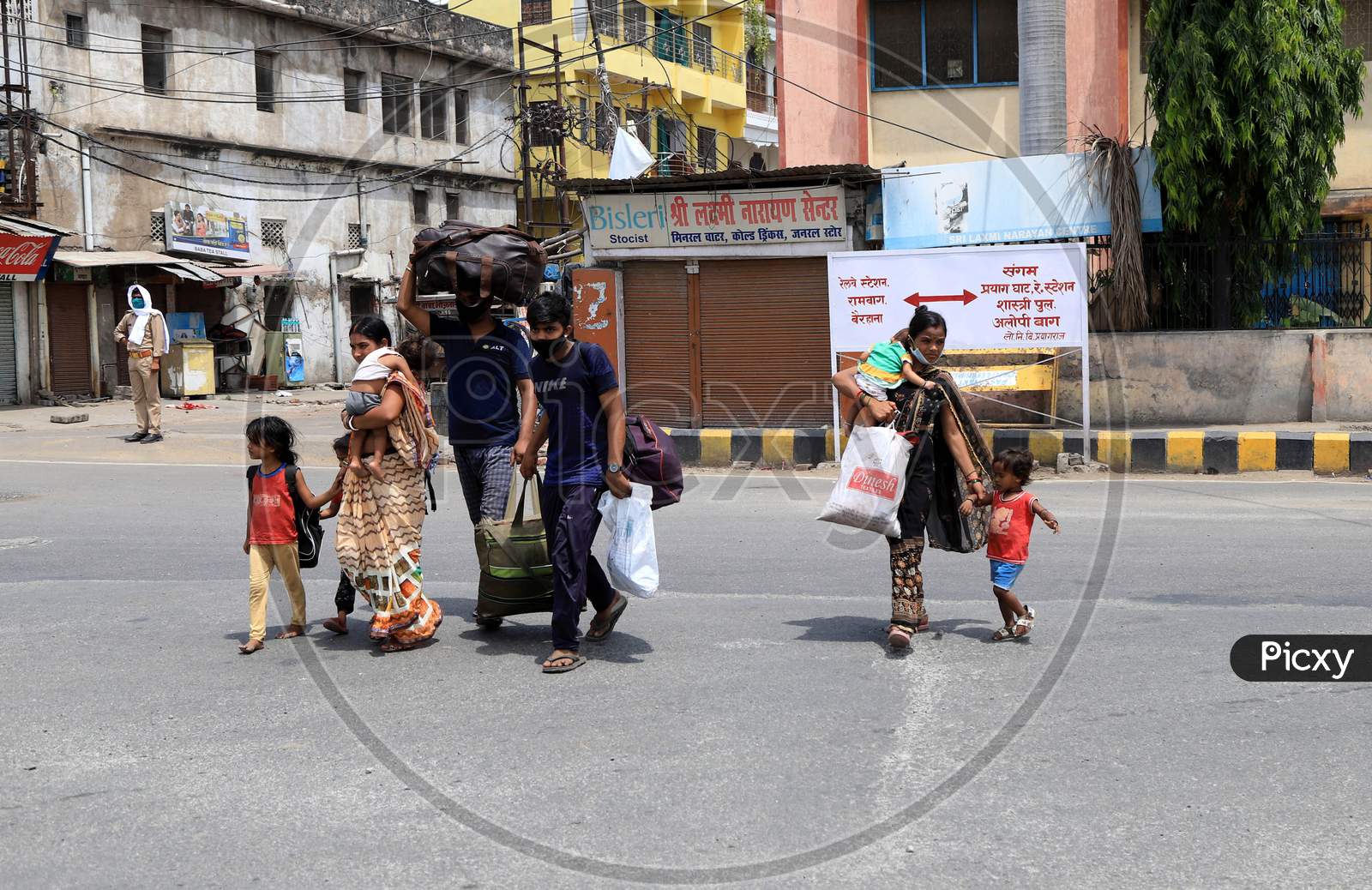 Migrant Workers' Family Walking On roads Carrying Luggage To Their Native Places During Extended Nationwide Lockdown Amidst Coronavirus Or COVID-19 Pandemic in Prayagraj