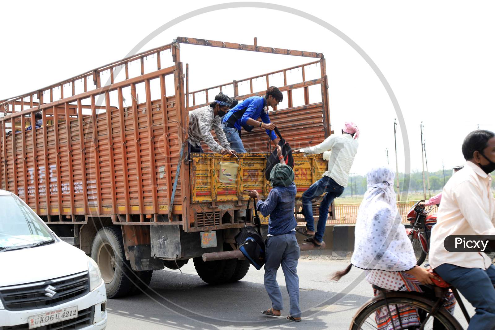 Migrant Workers Travelling By Trucks  To Their Native Places During Extended Nationwide Lockdown Amidst Coronavirus Or COVID-19 Pandemic in Prayagraj