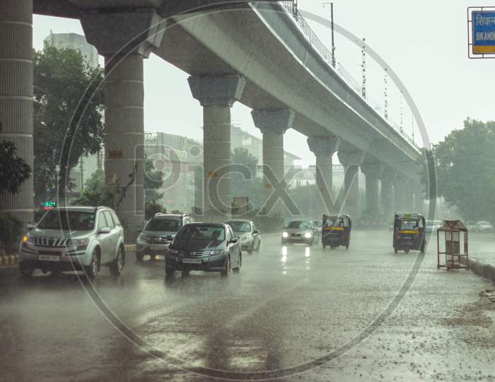 New Delhi, Delhi/ India- May 19 2020: Vehicles On Road When Ir Rained In Delhi, Monsoon Arrives In Delhi.