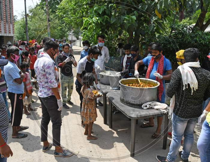 Cooked food is being given to family members who are unable to earn money due to lockdown in the emergence of Novel Coronavirus (COVID-19). At Burdwan Town.