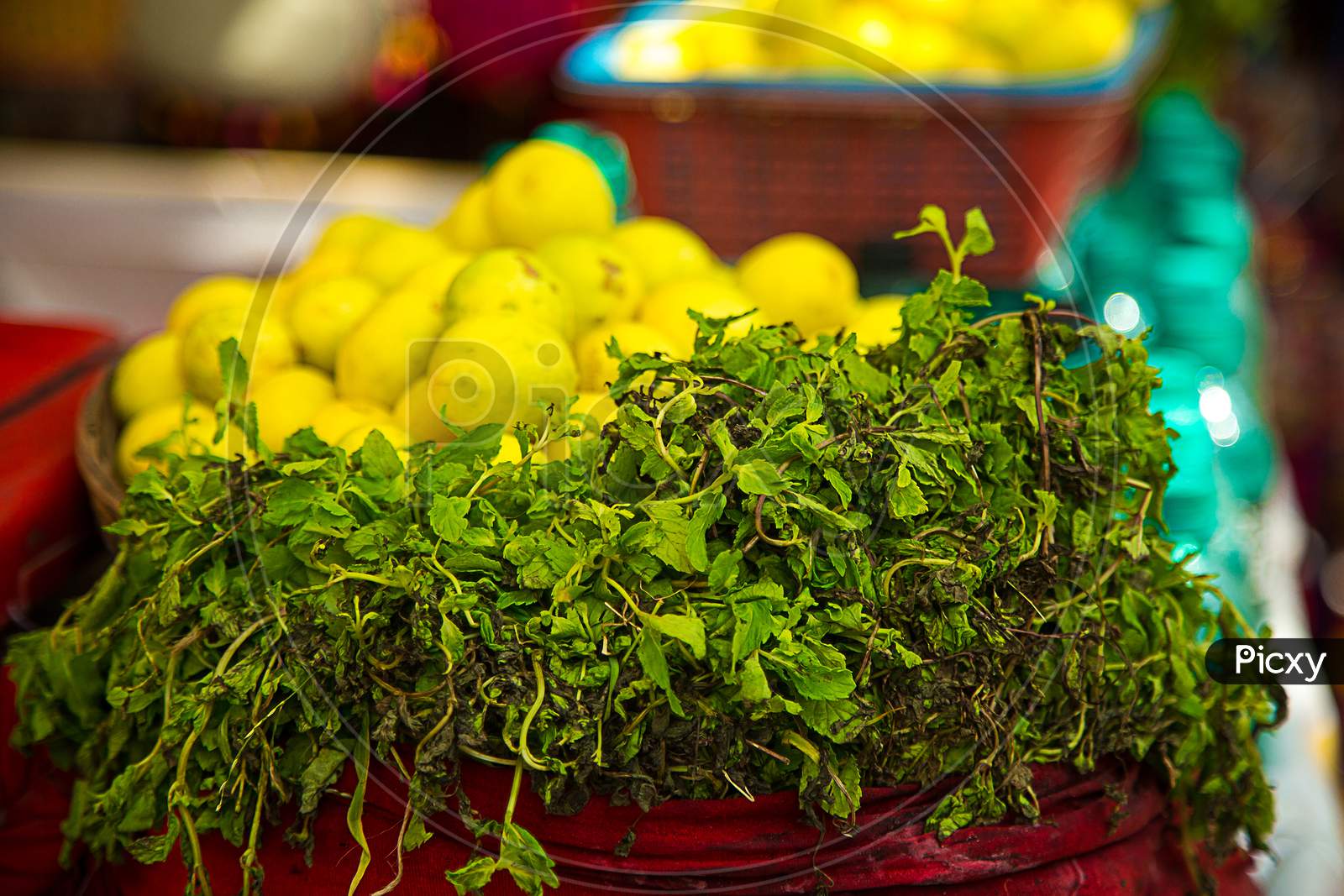Fresh Lemons And Lemons Leaves For Making Lemon Soda Juice Outdoor Street Market Background.