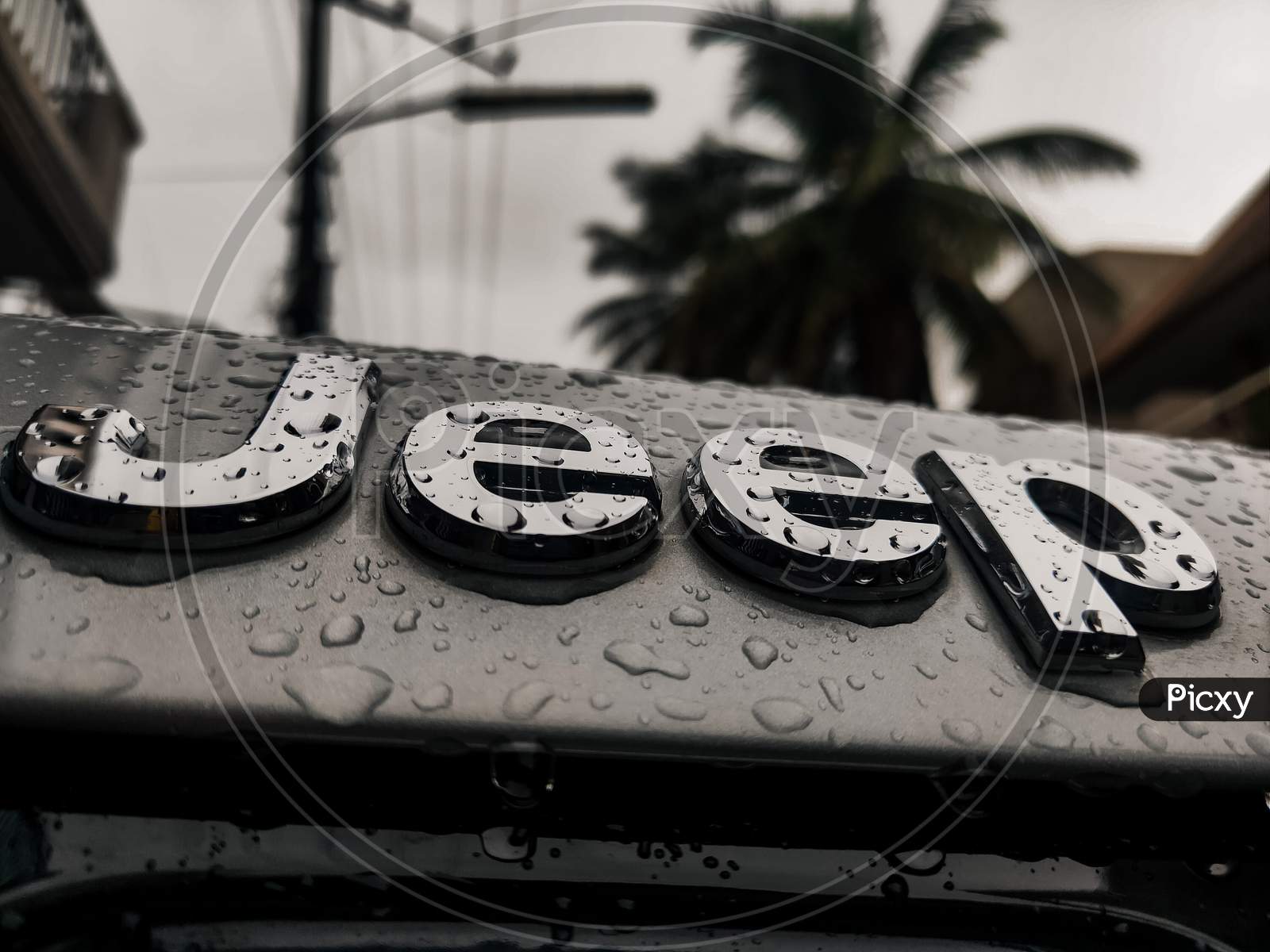 Jeep logo during rain