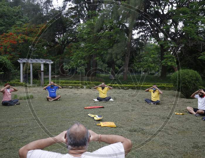 Men perform yoga in Cubbon Park after the state eased lockdown norms during the nationwide lockdown to prevent the spread of coronavirus (COVID-19) in Bangalore, India.