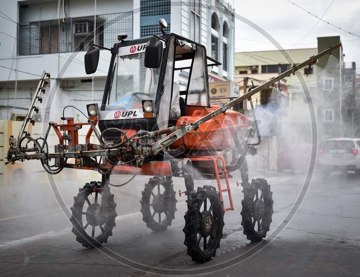 A Corporation Vehicle Sprays Disinfectant As A Precautionary Measure To Prevent The Spread Of Coronavirus, At A Covid-19 Contaminated Zone During The Nationwide Lockdown Imposed In The Wake Of Coronavirus, In Vijayawada.
