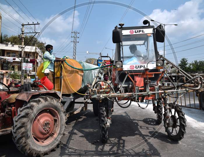 Disinfectant Spraying Vehicle Corporation Workers Fill Sodium Hypochlorite Solution Into A Disinfectant Spraying Vehicle During The Nationwide Lockdown Imposed In The Wake Of Coronavirus, In Vijayawada.