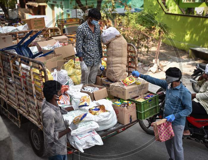People Buy Groceries From A Mobile Market At A Covid-19 Contaminated Zone During The Nationwide Lockdown Imposed In The Wake Of Coronavirus, In Vijayawada.