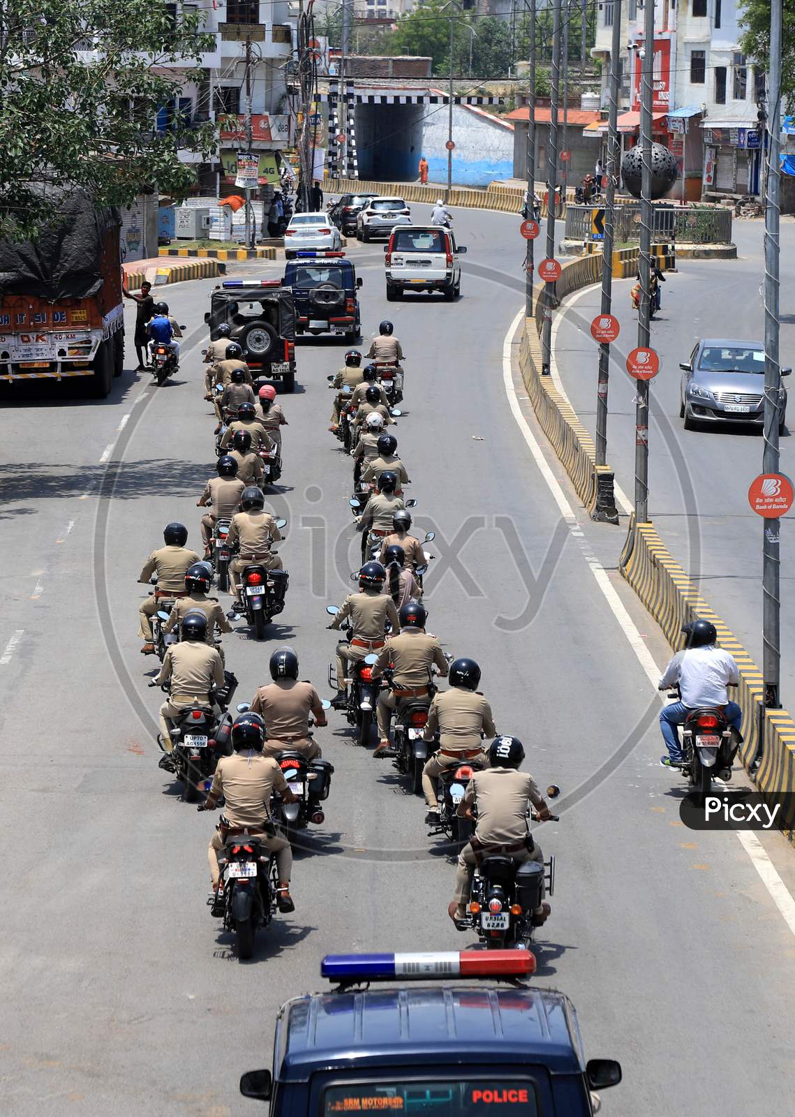Police personnel take part in a flag march during a government-imposed nationwide lockdown as a preventive measure against the COVID-19 or Coronavirus in Prayagraj, May 2, 2020.