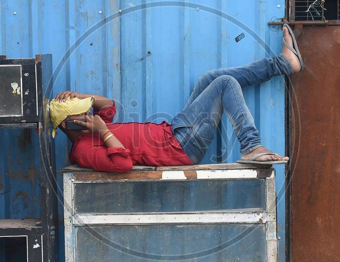 A migrant labourer rests during during a government-imposed nationwide lockdown as a preventive measure against the COVID-19 or Coronavirus, in Chennai 