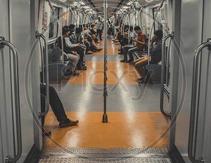 Metro inside people sitting