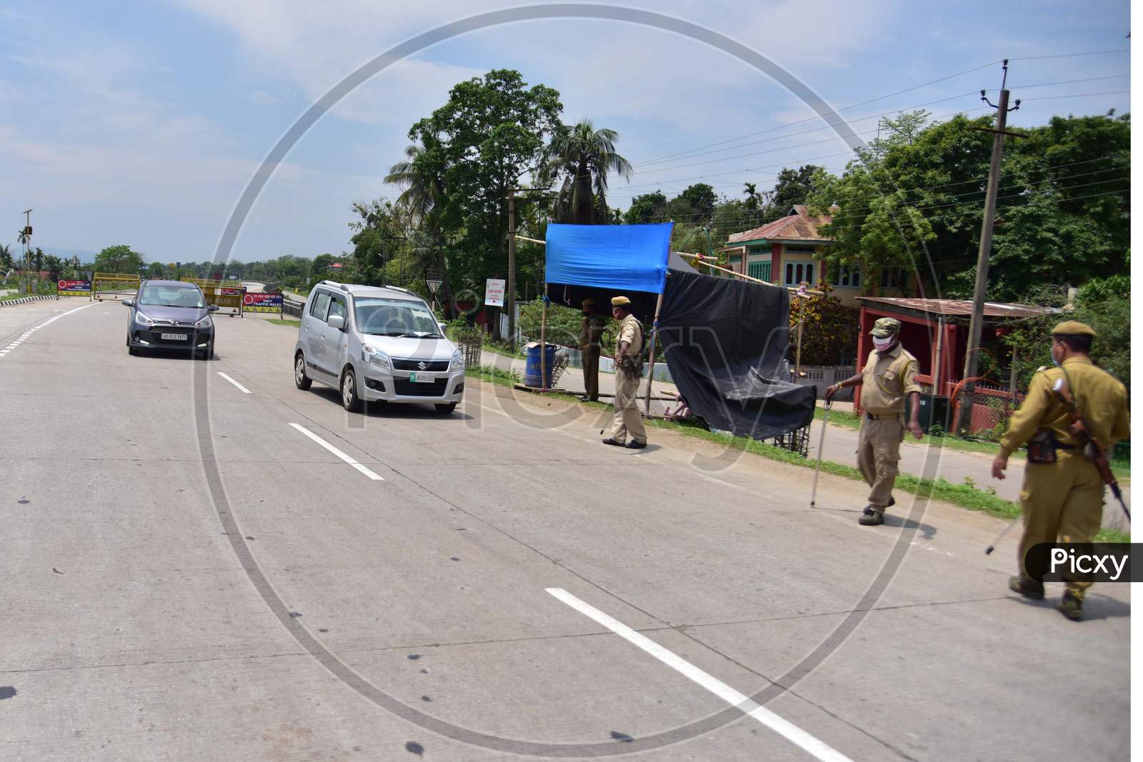 Security Personnel Checking Documents Of Commuters  During  Nationwide Lockdown Amidst Coronavirus or COVID-19  Pandemic  At Raha In Nagaon District Of Assam  On May 2,2020