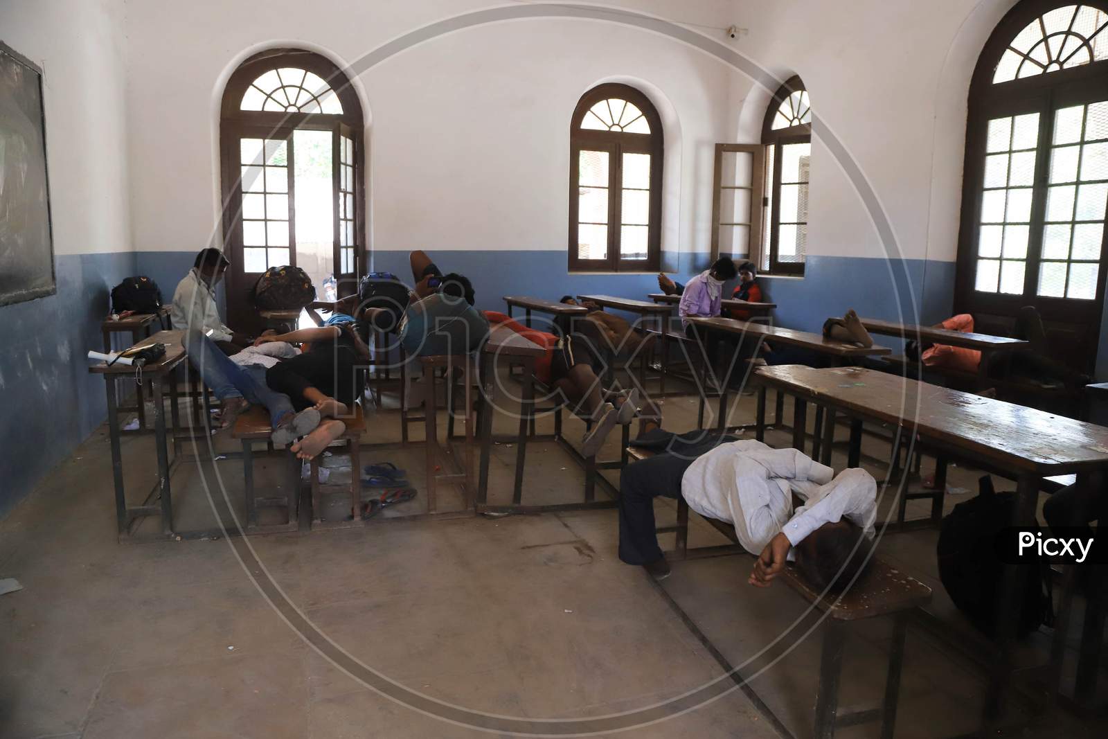 Migrant Workers Who Arrived From Madhya Pradesh Rest In a School Arranged by Government Officials During Nationwide Lockdown Amidst Coronavirus Or COVID-19 Pandemic in Prayagraj