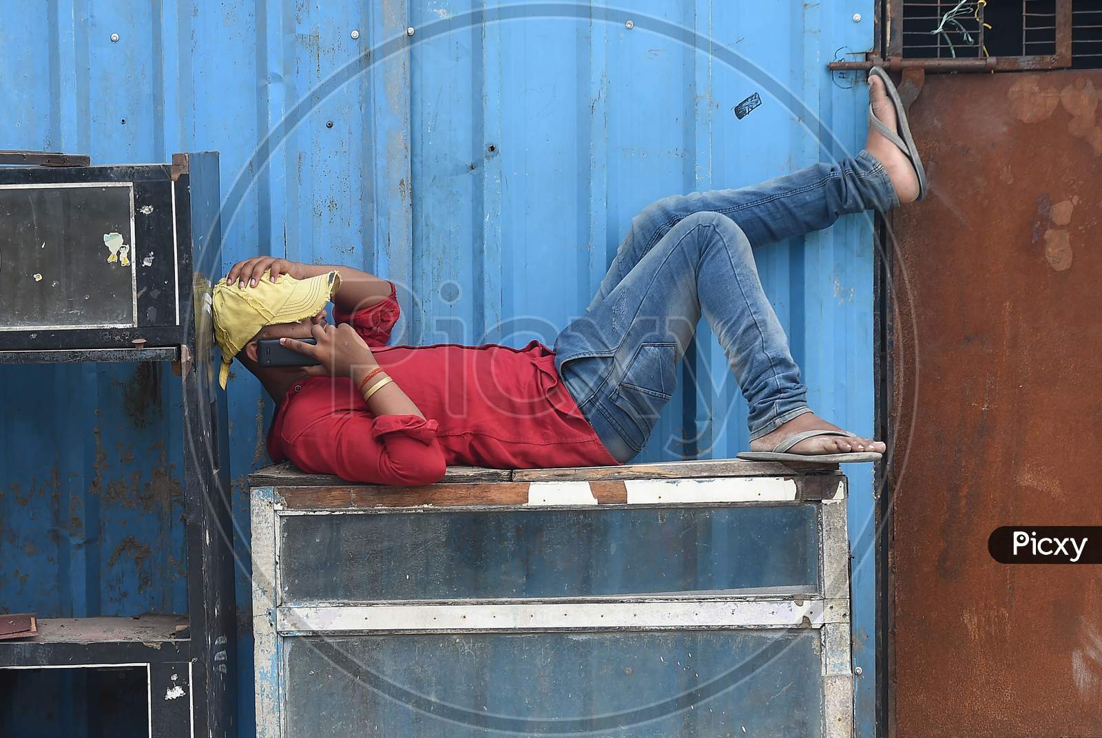 A migrant labourer rests during during a government-imposed nationwide lockdown as a preventive measure against the COVID-19 or Coronavirus, in Chennai 