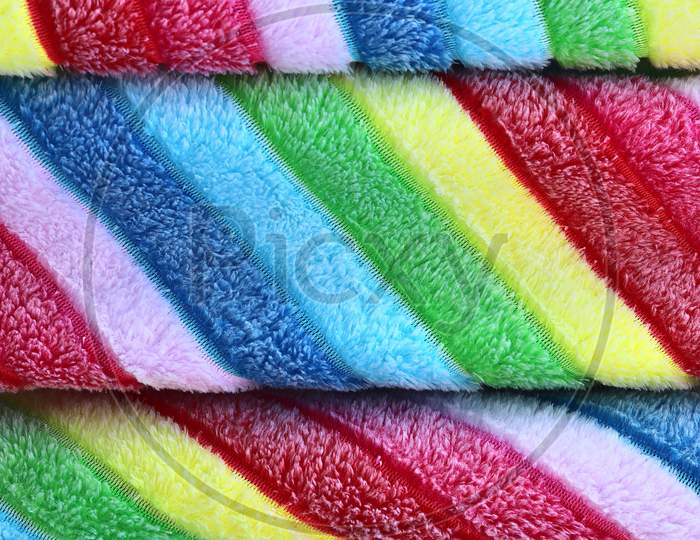 Detailed close up view on colorful textiles and fabrics texture in high resolution