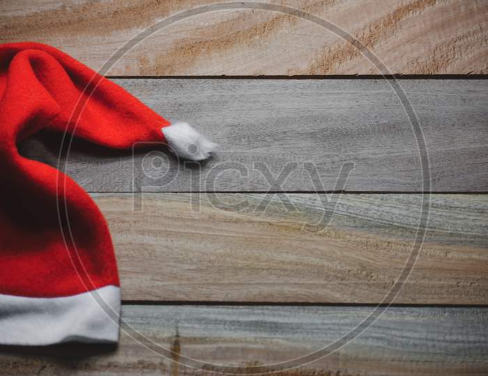 Christmas santa claus red hat on wooden background