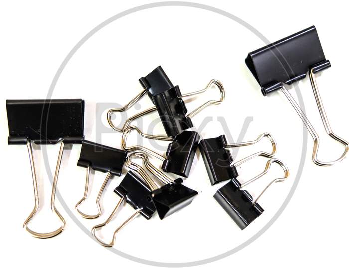 Black Paper clips, isolated on white background.