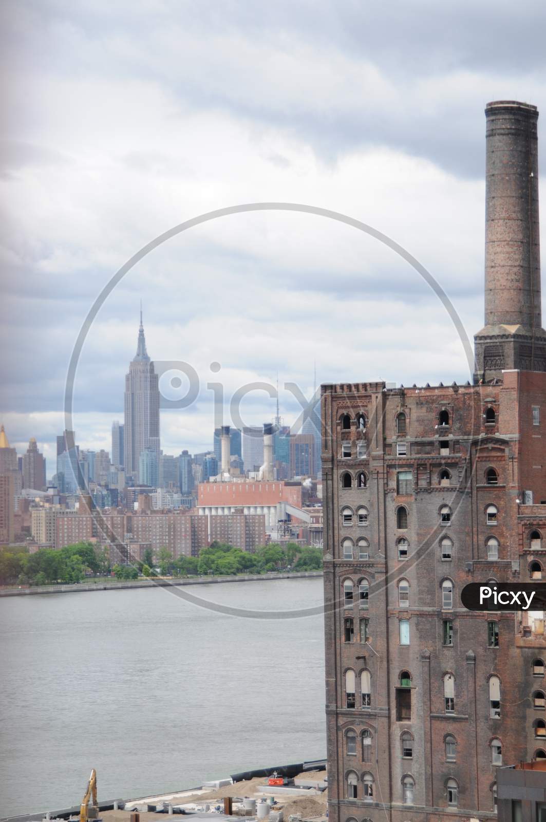 View Of The Domino Sugar Refinery, Manhattan And The East River