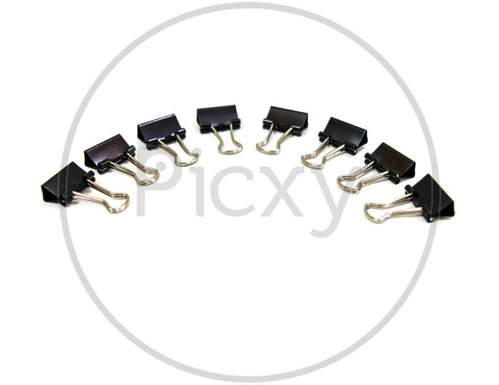 Black Paper clips, isolated on white background.