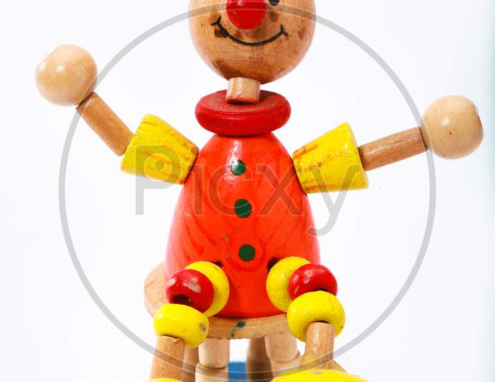 Wooden pinocchio doll sitting