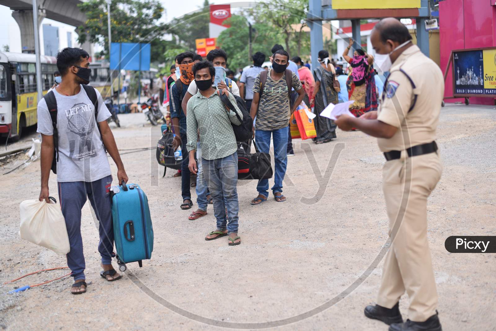 Migrant Workers from Bihar, Jharkhand and UP get themselves registered from Cyberabad Police to get onto a Shramik Special Train during ongoing Nationwide Lockdown amid Coronavirus Pandemic, Kukatpally,Hyderabad, May 19,2020.