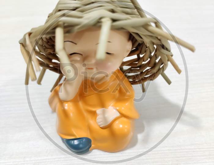 Small Buddha Statue Monk With Straw Hat Resin