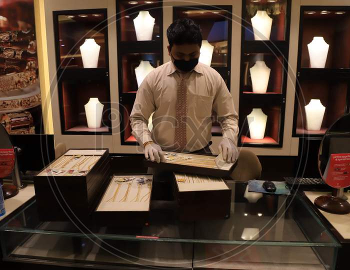A Salesman Arranges Jewellery At A Shop After  Authorities Allowed Shopkeepers To Open Their Establishments With Certain Restrictions During Coronavirus or COVID-19 Pandemic in Prayagraj, May 20,2020