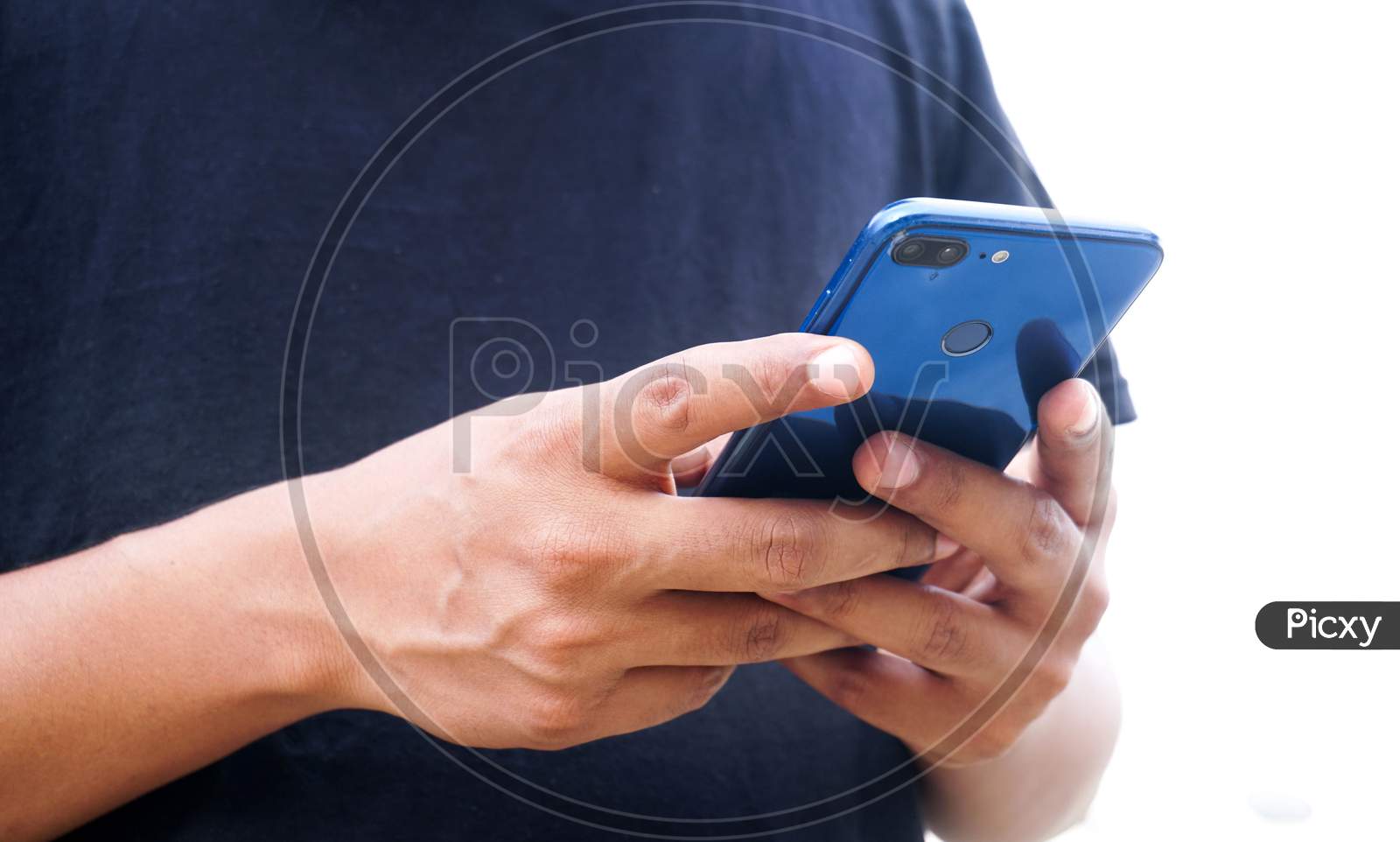 Young Indian man using smartphone