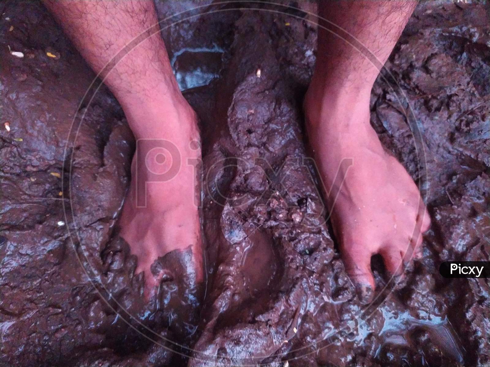 Dirty bare feets in mud