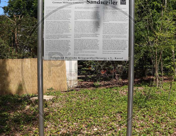 Sign At Sandweiler German War Cemetery