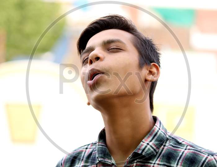 portrait of funny guy, Asian boy yawning with funny style open mouth