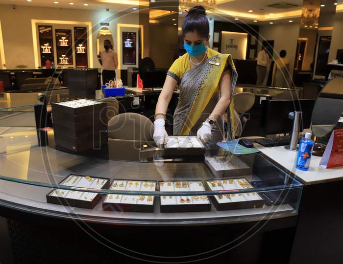 A Sales Girl Arranges Jewellery At A Shop After  Authorities Allowed Shopkeepers To Open Their Establishments With Certain Restrictions During Coronavirus or COVID-19 Pandemic in Prayagraj, May 20,2020