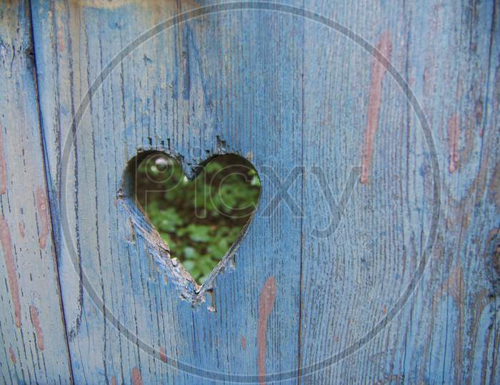 Heart Shape Engraved On A Wooden Board