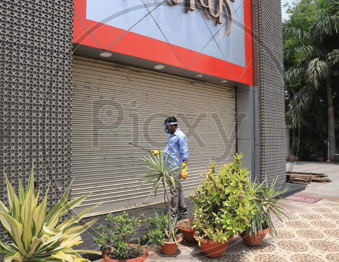 A Worker Sanitises The Shop  After  Authorities Allowed Shopkeepers To Open Their Establishments With Certain Restrictions During Coronavirus or COVID-19 Pandemic in Prayagraj, May 20,2020