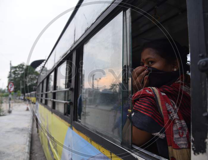 Migrant woman worker waits in a bus after registering from Cyberabad Police to get onto a Shramik Special Train during ongoing Nationwide Lockdown amid Coronavirus Pandemic, Kukatpally,Hyderabad, May 19,2020.