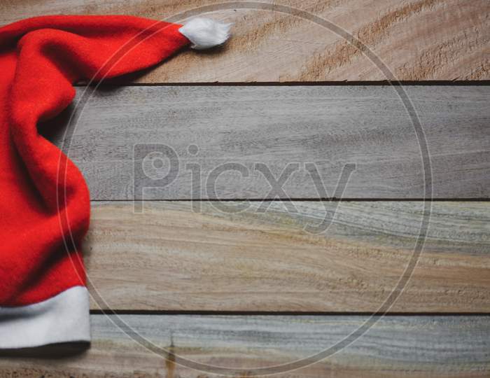 Christmas santa claus red hat on wooden background