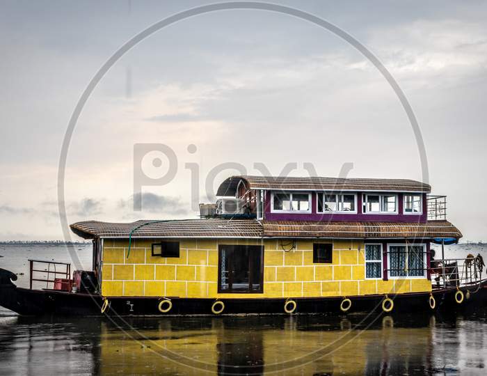 Houseboat Isolated In Backwater With Sky And Cloud