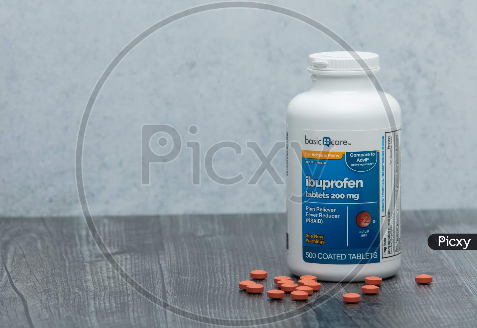 Bottle Of Generic Brand Ibuprofen On Wooden Table