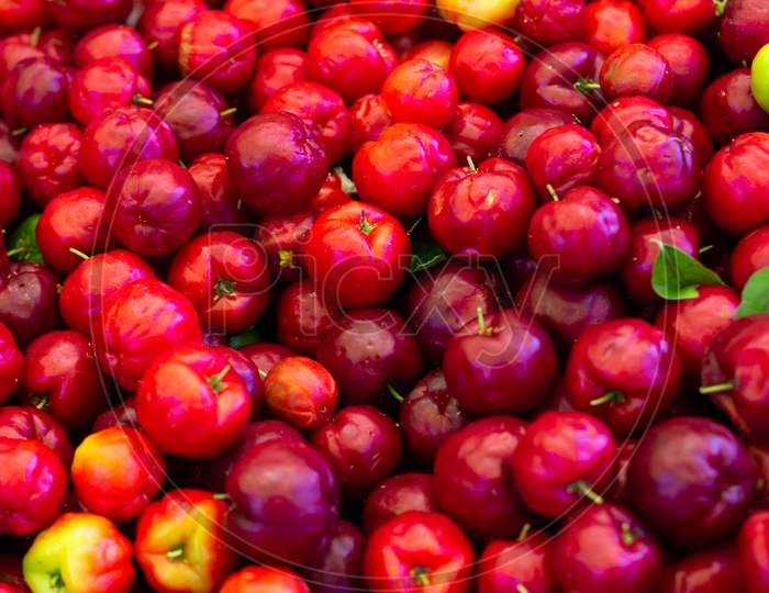 Numerous Cherries In The Market. Fresh Fruits Of The Tropic. Some Colorful Sweet And Sour Fruits.