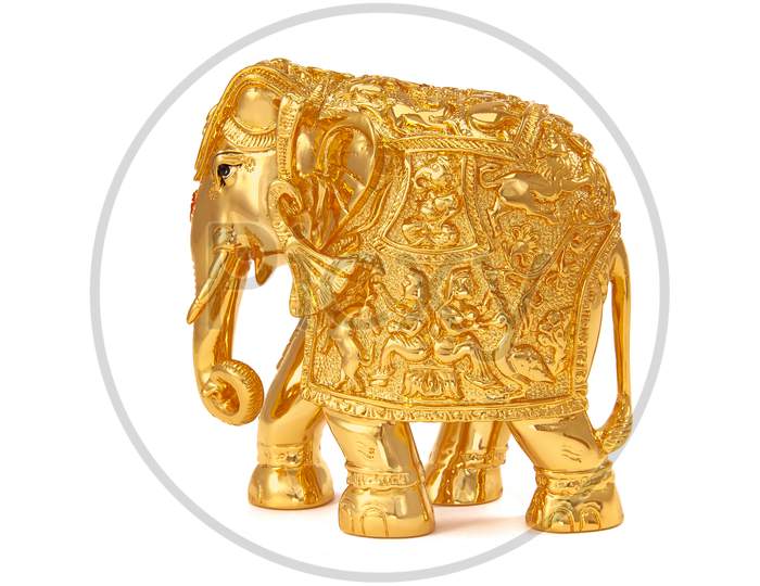 Decorative Golden elephant also known as Gajantalaxmi isolated over white Background